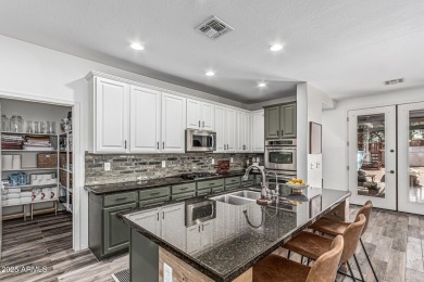 A beautifully crafted 4-bedroom, 2.5-bath Farmhouse-style home on Verrado Golf Club  in Arizona - for sale on GolfHomes.com, golf home, golf lot