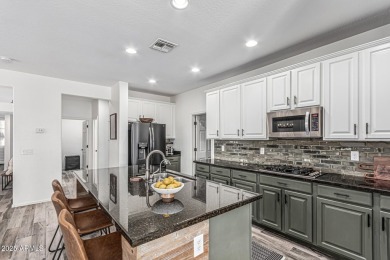 A beautifully crafted 4-bedroom, 2.5-bath Farmhouse-style home on Verrado Golf Club  in Arizona - for sale on GolfHomes.com, golf home, golf lot