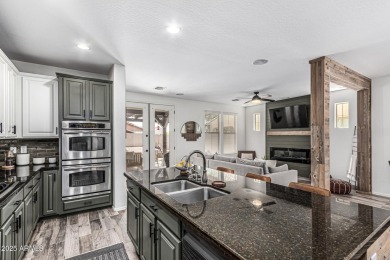 A beautifully crafted 4-bedroom, 2.5-bath Farmhouse-style home on Verrado Golf Club  in Arizona - for sale on GolfHomes.com, golf home, golf lot