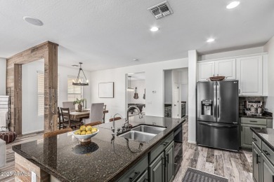 A beautifully crafted 4-bedroom, 2.5-bath Farmhouse-style home on Verrado Golf Club  in Arizona - for sale on GolfHomes.com, golf home, golf lot