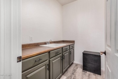 A beautifully crafted 4-bedroom, 2.5-bath Farmhouse-style home on Verrado Golf Club  in Arizona - for sale on GolfHomes.com, golf home, golf lot
