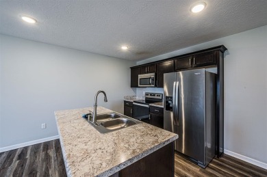 Discover modern comfort and effortless convenience in this on Franklin Country Club in Kentucky - for sale on GolfHomes.com, golf home, golf lot