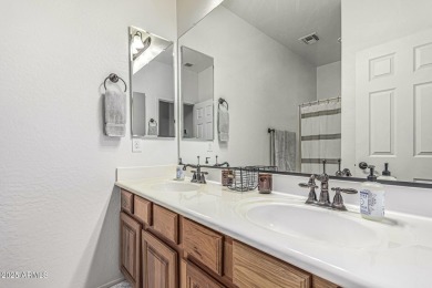 A beautifully crafted 4-bedroom, 2.5-bath Farmhouse-style home on Verrado Golf Club  in Arizona - for sale on GolfHomes.com, golf home, golf lot
