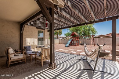 A beautifully crafted 4-bedroom, 2.5-bath Farmhouse-style home on Verrado Golf Club  in Arizona - for sale on GolfHomes.com, golf home, golf lot