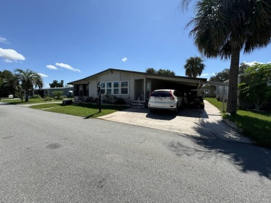 This home is set up to enjoy the Florida lifestyle! This on Lake Henry Golf Club in Florida - for sale on GolfHomes.com, golf home, golf lot