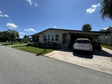 This home is set up to enjoy the Florida lifestyle! This on Lake Henry Golf Club in Florida - for sale on GolfHomes.com, golf home, golf lot