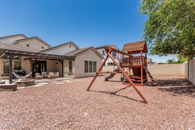 A beautifully crafted 4-bedroom, 2.5-bath Farmhouse-style home on Verrado Golf Club  in Arizona - for sale on GolfHomes.com, golf home, golf lot