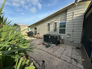 This home is set up to enjoy the Florida lifestyle! This on Lake Henry Golf Club in Florida - for sale on GolfHomes.com, golf home, golf lot