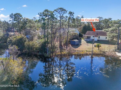 Looking for lakefront living that's comfortable, updated, and on The Lakes Country Club in North Carolina - for sale on GolfHomes.com, golf home, golf lot