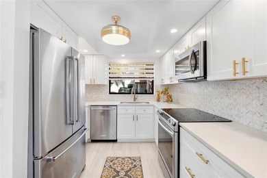 Welcome to effortless Florida living in this UPDATED, MOVE-IN on Deer Creek Golf Club in Florida - for sale on GolfHomes.com, golf home, golf lot