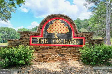 Welcome to your dream retreat! This stunning 1.78-acre lot is on The Orchard Golf and Country Club in Georgia - for sale on GolfHomes.com, golf home, golf lot