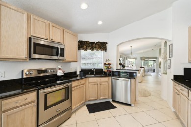 LOVELY 2 Bedroom, 2 Bath plus den BORDEAUX Model with CANAL and on Poinciana Golf Club in Florida - for sale on GolfHomes.com, golf home, golf lot