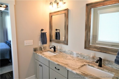 This picturesque home in the gated section of Kings Grant golf on Kings Grant Golf and Country Club in North Carolina - for sale on GolfHomes.com, golf home, golf lot
