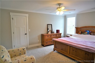 This picturesque home in the gated section of Kings Grant golf on Kings Grant Golf and Country Club in North Carolina - for sale on GolfHomes.com, golf home, golf lot