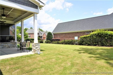 This picturesque home in the gated section of Kings Grant golf on Kings Grant Golf and Country Club in North Carolina - for sale on GolfHomes.com, golf home, golf lot