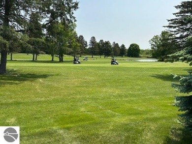 CHIC - ELEGANT - SPACIOUS!  Step into this warm and welcoming on The Pines Golf Course at Lake Isabella in Michigan - for sale on GolfHomes.com, golf home, golf lot