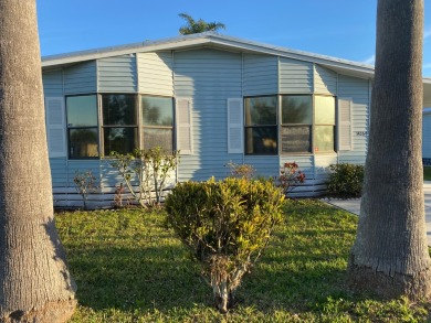 Cozy Open Concept mobile home in vibrant 55+ community on leased on Spanish Lakes Fairways in Florida - for sale on GolfHomes.com, golf home, golf lot