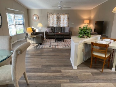 Cozy Open Concept mobile home in vibrant 55+ community on leased on Spanish Lakes Fairways in Florida - for sale on GolfHomes.com, golf home, golf lot