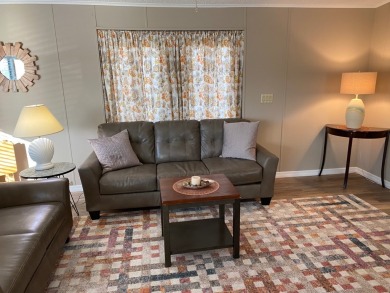 Cozy Open Concept mobile home in vibrant 55+ community on leased on Spanish Lakes Fairways in Florida - for sale on GolfHomes.com, golf home, golf lot