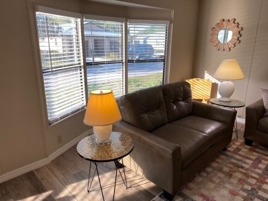 Cozy Open Concept mobile home in vibrant 55+ community on leased on Spanish Lakes Fairways in Florida - for sale on GolfHomes.com, golf home, golf lot