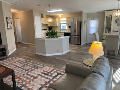 Cozy Open Concept mobile home in vibrant 55+ community on leased on Spanish Lakes Fairways in Florida - for sale on GolfHomes.com, golf home, golf lot