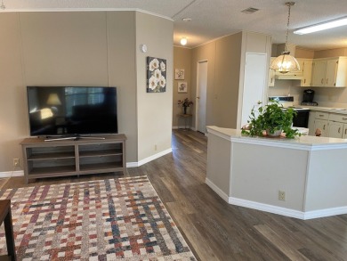 Cozy Open Concept mobile home in vibrant 55+ community on leased on Spanish Lakes Fairways in Florida - for sale on GolfHomes.com, golf home, golf lot