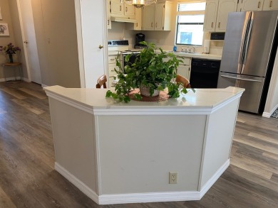 Cozy Open Concept mobile home in vibrant 55+ community on leased on Spanish Lakes Fairways in Florida - for sale on GolfHomes.com, golf home, golf lot