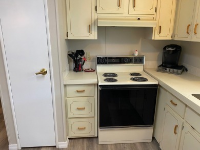 Cozy Open Concept mobile home in vibrant 55+ community on leased on Spanish Lakes Fairways in Florida - for sale on GolfHomes.com, golf home, golf lot