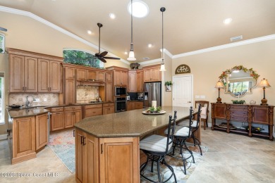Enjoy luxury living with elegant indoor  outdoor features on Indian River Colony Club in Florida - for sale on GolfHomes.com, golf home, golf lot