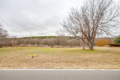 Nestled on nearly two acres with rare Brazos River frontage on Pecan Plantation Country Club in Texas - for sale on GolfHomes.com, golf home, golf lot