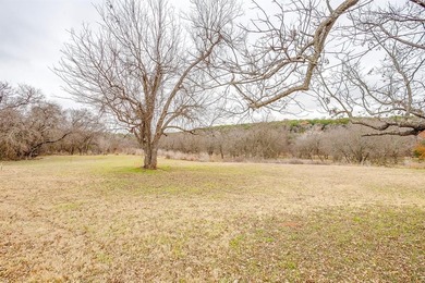 Nestled on nearly two acres with rare Brazos River frontage on Pecan Plantation Country Club in Texas - for sale on GolfHomes.com, golf home, golf lot