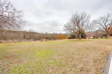 Nestled on nearly two acres with rare Brazos River frontage on Pecan Plantation Country Club in Texas - for sale on GolfHomes.com, golf home, golf lot