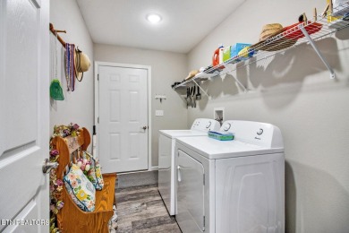This stunning low-maintenance home is less than 3 years old and on Lake Tansi Village Country Club in Tennessee - for sale on GolfHomes.com, golf home, golf lot