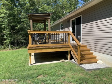 This stunning low-maintenance home is less than 3 years old and on Lake Tansi Village Country Club in Tennessee - for sale on GolfHomes.com, golf home, golf lot