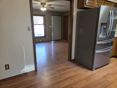 Welcome home to this inviting 3-bedroom, all-electric property on Cherokee Village South Course in Arkansas - for sale on GolfHomes.com, golf home, golf lot