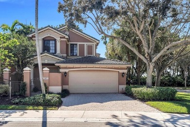 Immaculate corner residence with serene views of lush greenery on Weston Hills Country Club in Florida - for sale on GolfHomes.com, golf home, golf lot