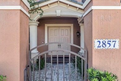 Immaculate corner residence with serene views of lush greenery on Weston Hills Country Club in Florida - for sale on GolfHomes.com, golf home, golf lot