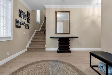 Immaculate corner residence with serene views of lush greenery on Weston Hills Country Club in Florida - for sale on GolfHomes.com, golf home, golf lot