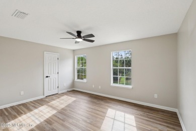 Welcome to this inviting home in Chatham Village at Fleming on Golf Club At Fleming Island in Florida - for sale on GolfHomes.com, golf home, golf lot