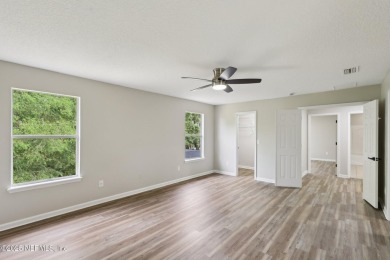 Welcome to this inviting home in Chatham Village at Fleming on Golf Club At Fleming Island in Florida - for sale on GolfHomes.com, golf home, golf lot