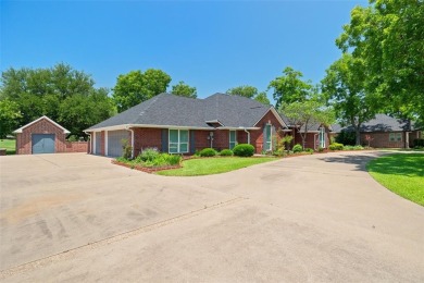 PRIDE OF OWNERSHIP is reflected at every turn in this spacious on Pecan Plantation Country Club in Texas - for sale on GolfHomes.com, golf home, golf lot