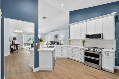 Over $150,000 in upgrades within the past two years make this on Hunters Green Country Club in Florida - for sale on GolfHomes.com, golf home, golf lot