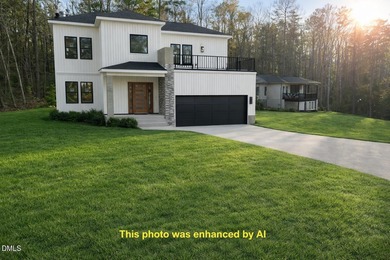 Stunning modern new construction in the gated lake community of on River Golf and Country Club at Lake Royale in North Carolina - for sale on GolfHomes.com, golf home, golf lot