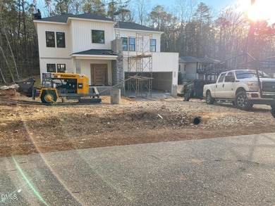 Stunning modern new construction in the gated lake community of on River Golf and Country Club at Lake Royale in North Carolina - for sale on GolfHomes.com, golf home, golf lot