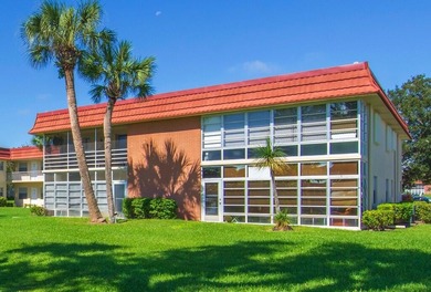 Beautifully updated first-floor unit with golf views! Desirable on The American Golf Club in Florida - for sale on GolfHomes.com, golf home, golf lot