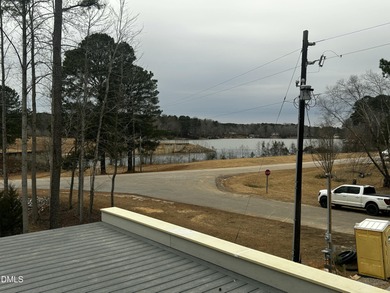 Stunning modern new construction in the gated lake community of on River Golf and Country Club at Lake Royale in North Carolina - for sale on GolfHomes.com, golf home, golf lot