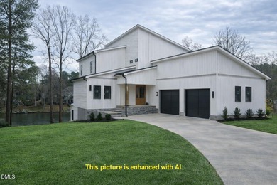 Discover lakeside luxury and convenience in this stunning on River Golf and Country Club at Lake Royale in North Carolina - for sale on GolfHomes.com, golf home, golf lot