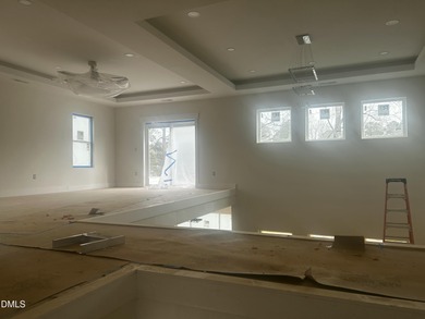 Discover lakeside luxury and convenience in this stunning on River Golf and Country Club at Lake Royale in North Carolina - for sale on GolfHomes.com, golf home, golf lot