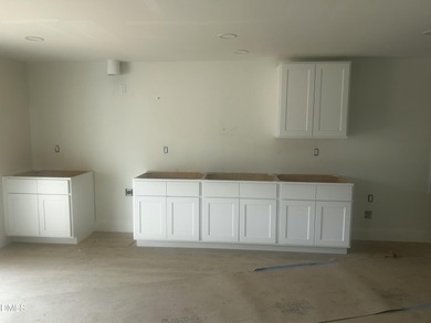 Discover lakeside luxury and convenience in this stunning on River Golf and Country Club at Lake Royale in North Carolina - for sale on GolfHomes.com, golf home, golf lot