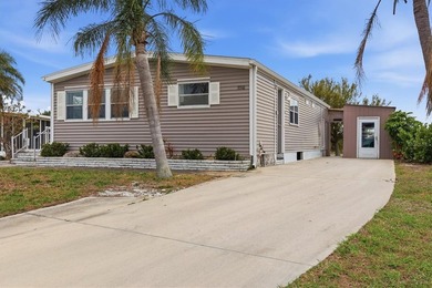 Welcome to this charming double-wide manufactured home located on Lemon Bay Golf Club in Florida - for sale on GolfHomes.com, golf home, golf lot